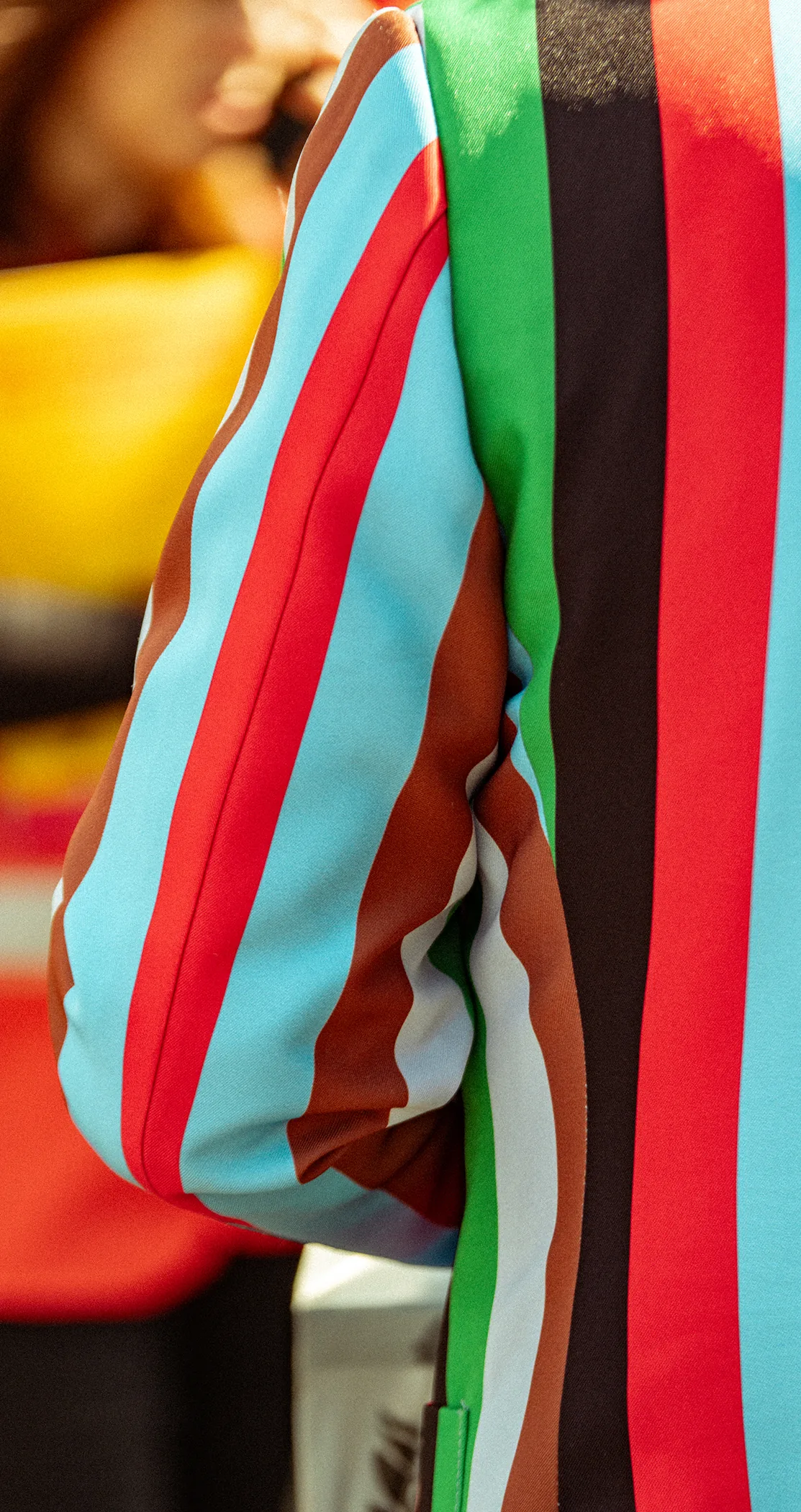 The bold stripes of a Harlequins jacket, close up